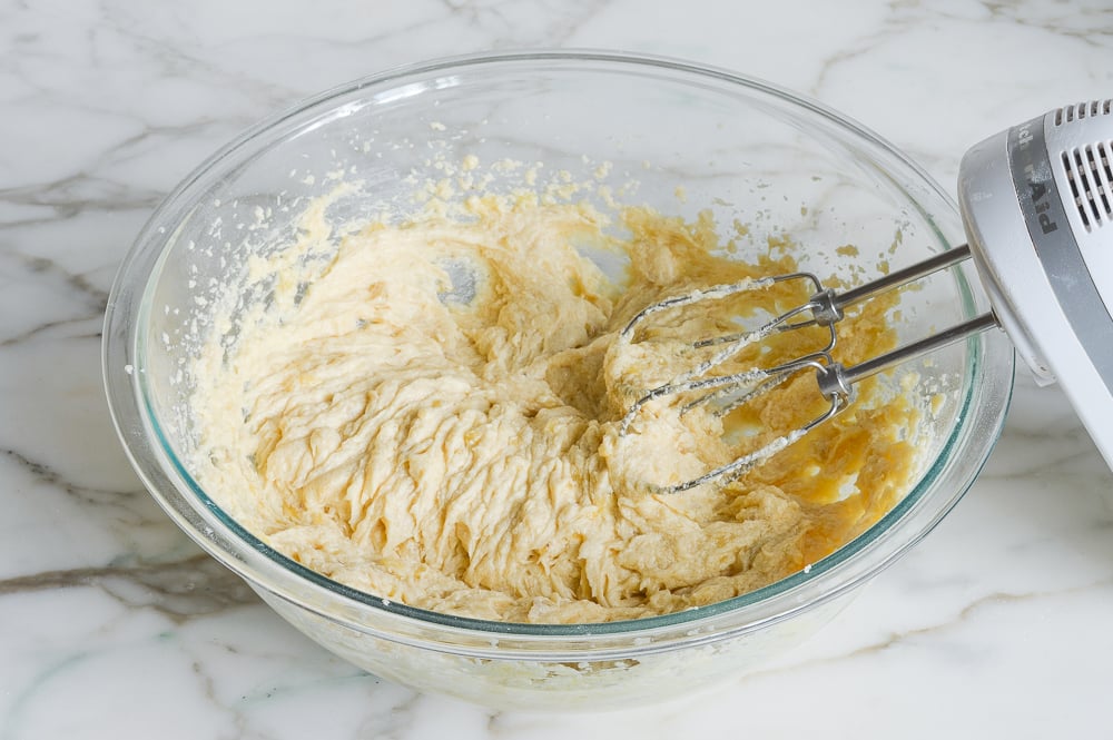 Electric mixer with a bowl of batter.