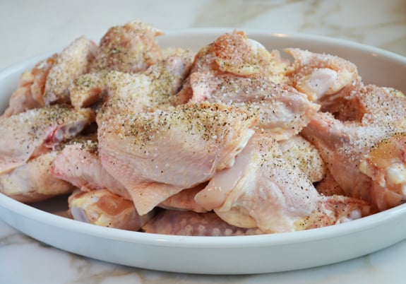 Seasoned wings on a plate.