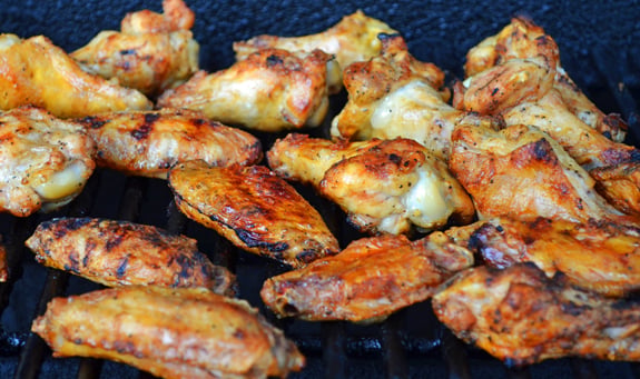 Seasoned wings on the grill.