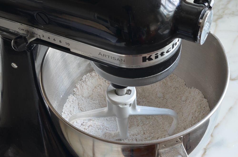 Flour, sugars, baking powder and salt mixed together in mixer 