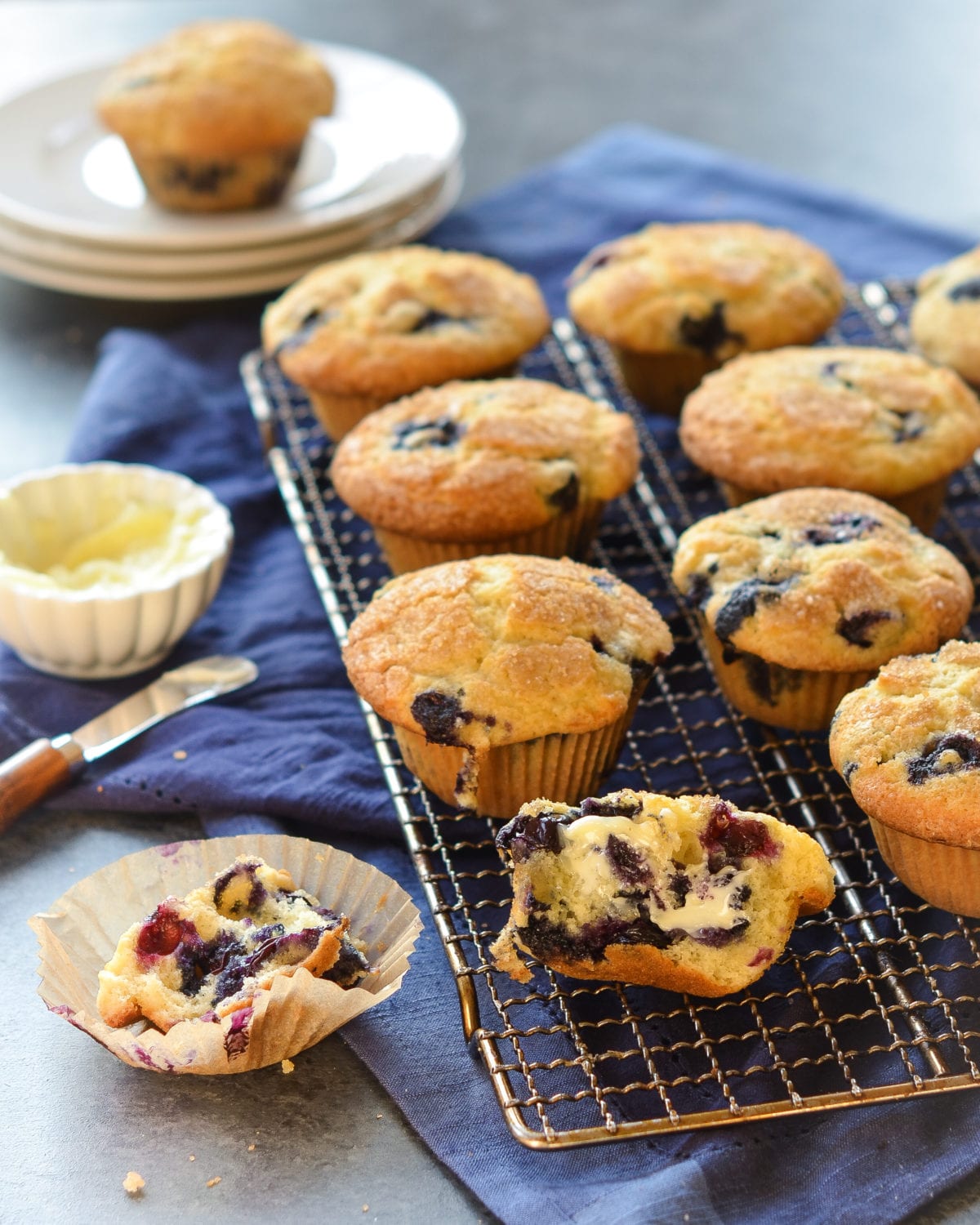 Blueberry muffins on a wire rack.