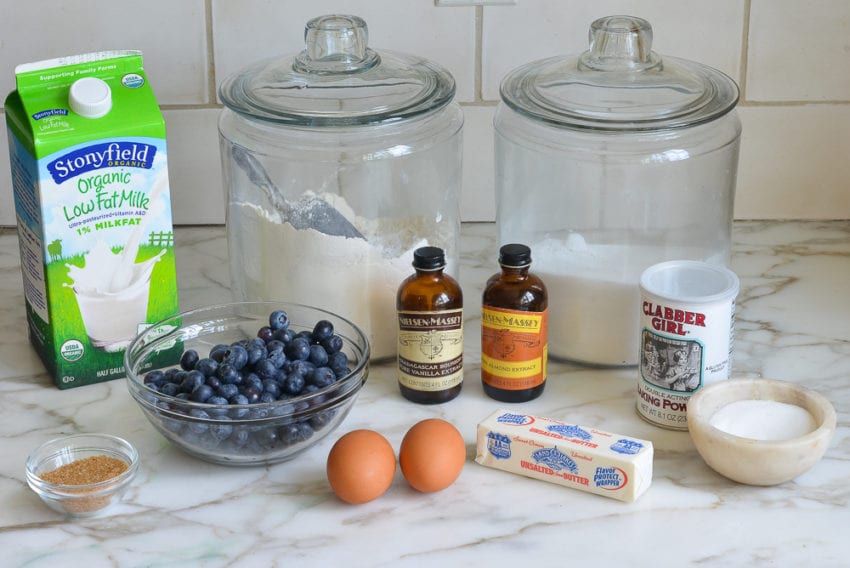 Muffin ingredients including blueberries, vanilla, and milk.