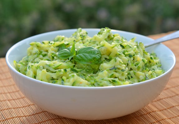 Bowl of creamed zucchini with garlic and basil.
