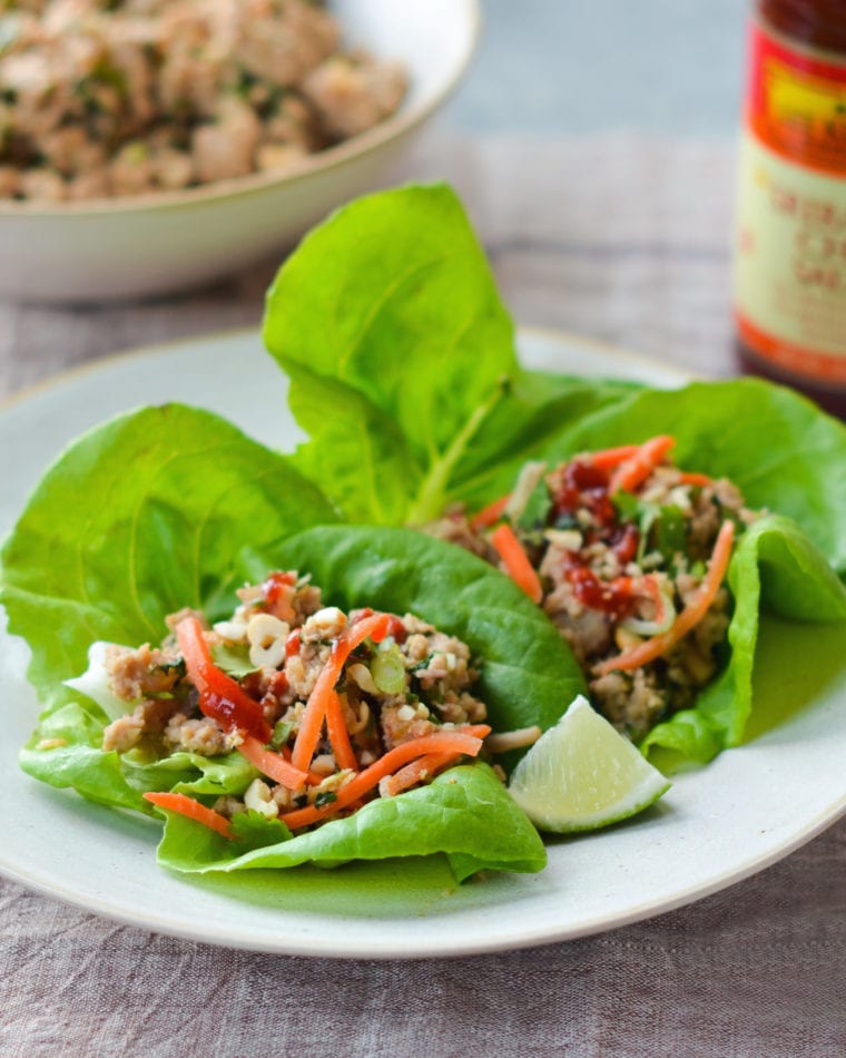 Thai-style minced chicken lettuce cups on a plate.