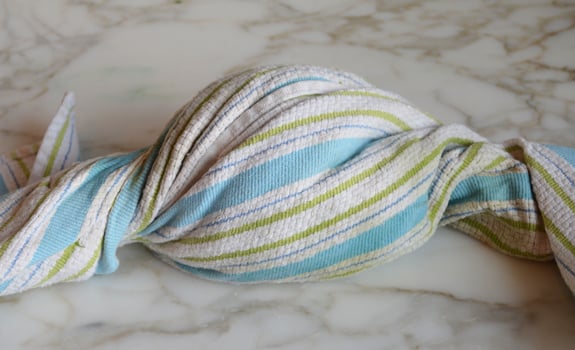Twisted towel full of shredded zucchini.
