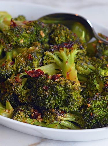 Dish of roasted broccoli with chipotle honey butter.