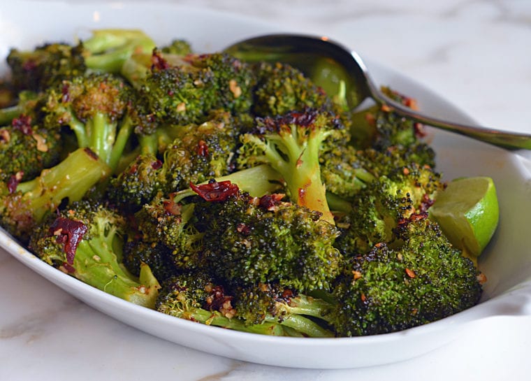 Dish of roasted broccoli with chipotle honey butter.