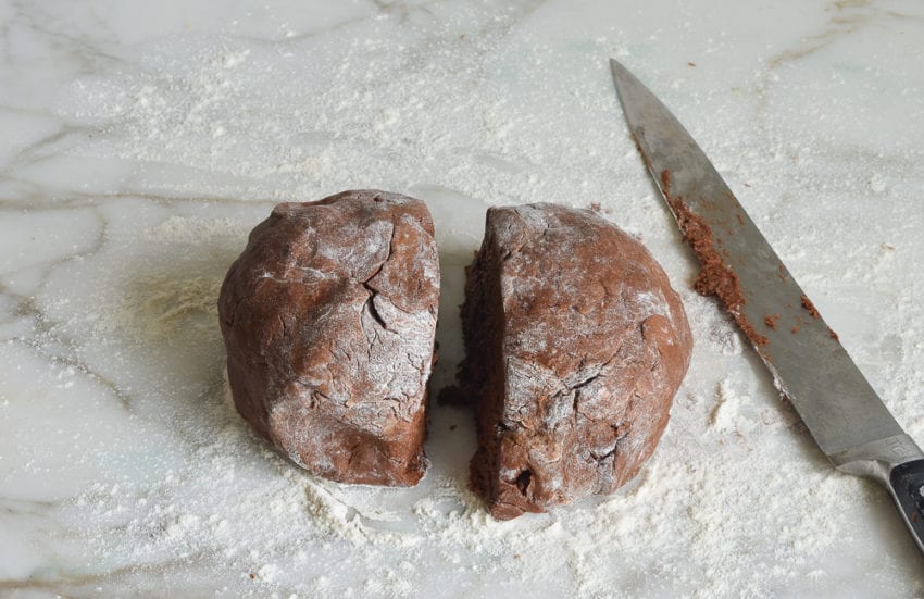 Ball of dough cut in half.