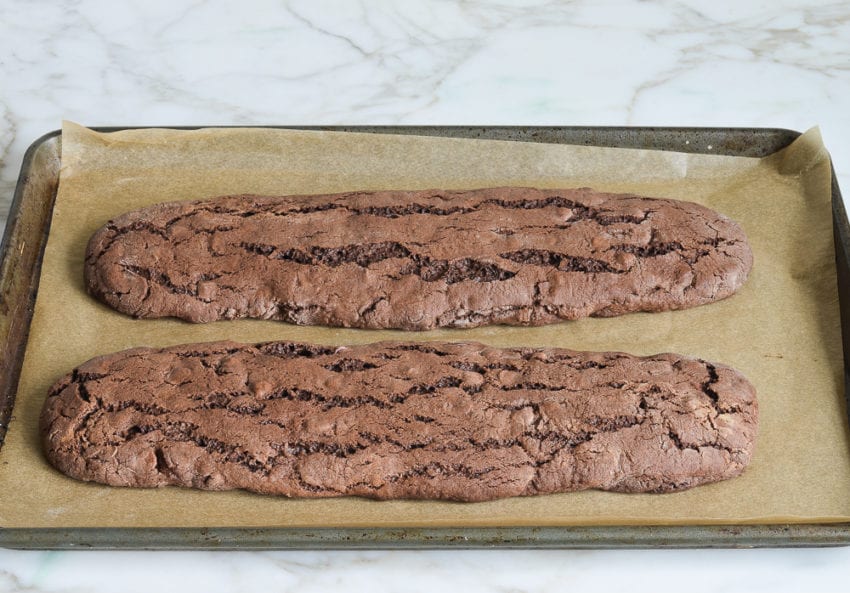 Two baked logs of double chocolate biscotti.