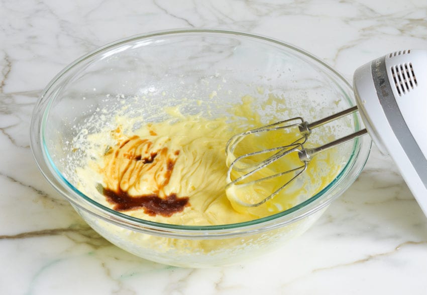 Vanilla extract in a bowl with an egg mixture.