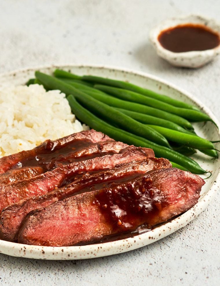 broiled flat iron steak with green beans and rice