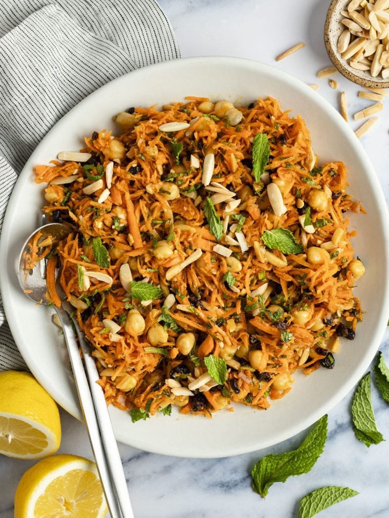 moroccan-spiced carrot and chickpea salad in white bowl.