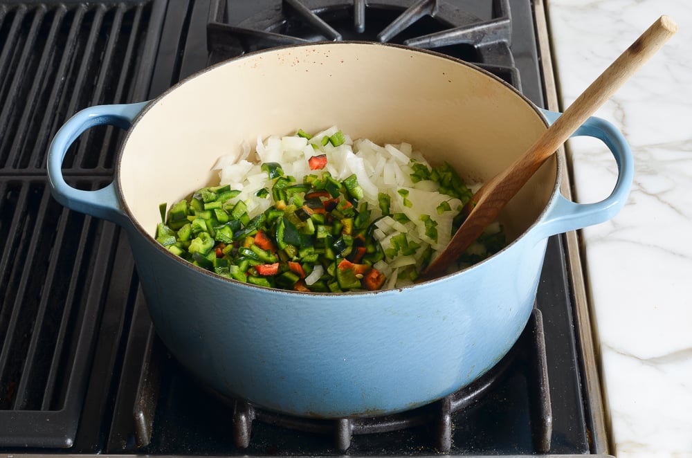 oil, onion, and peppers in pot