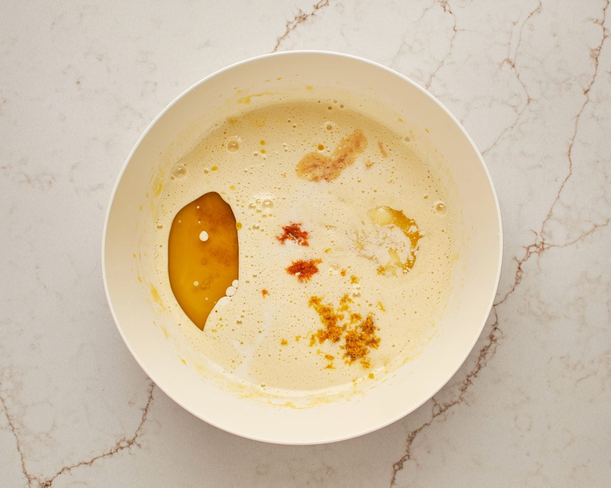 Milk, olive oil, melted butter, lemon zest, orange zest and vanilla added to egg mixture.