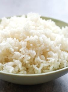 Spoon in a bowl of jasmine rice.