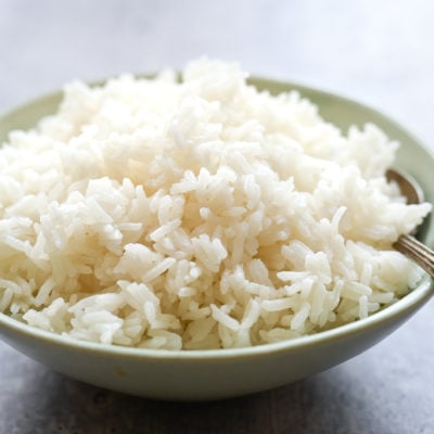 Spoon in a bowl of jasmine rice.
