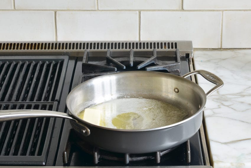 Butter melting in a skillet.