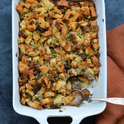 Spoon in a baking dish of sausage and herb stuffing .