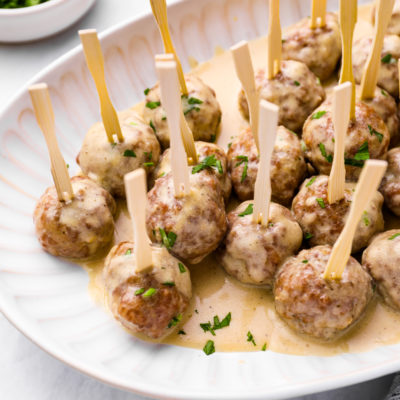 Plate of Swedish meatballs on small skewers.