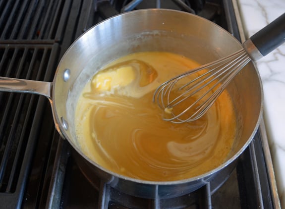 Whisk in a sauce pan of toffee sauce.