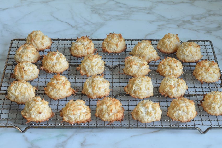 Coconut macaroons on a wire rack.