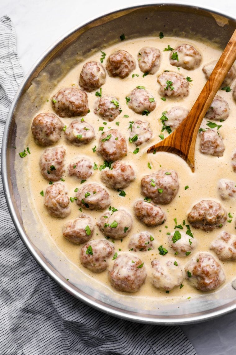 Swedish meatballs in cream sauce in skillet