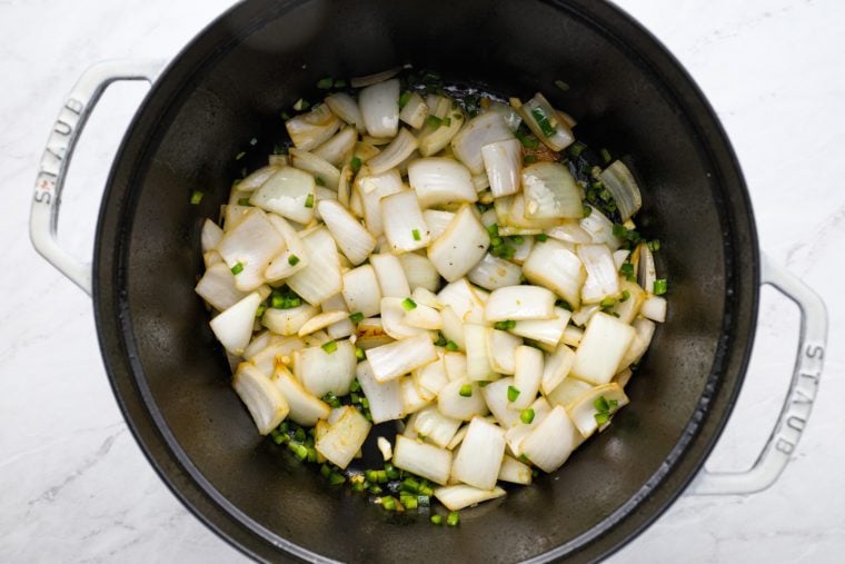 adding garlic and jalapeno pepper