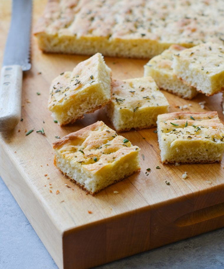 Pieces of focaccia on a cutting board.