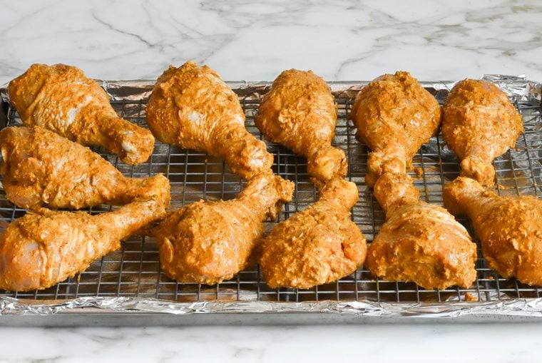 marinated chicken on rack
