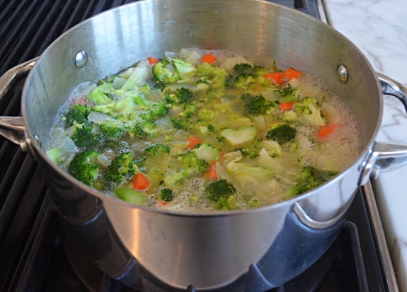 Soup simmering in a pan.