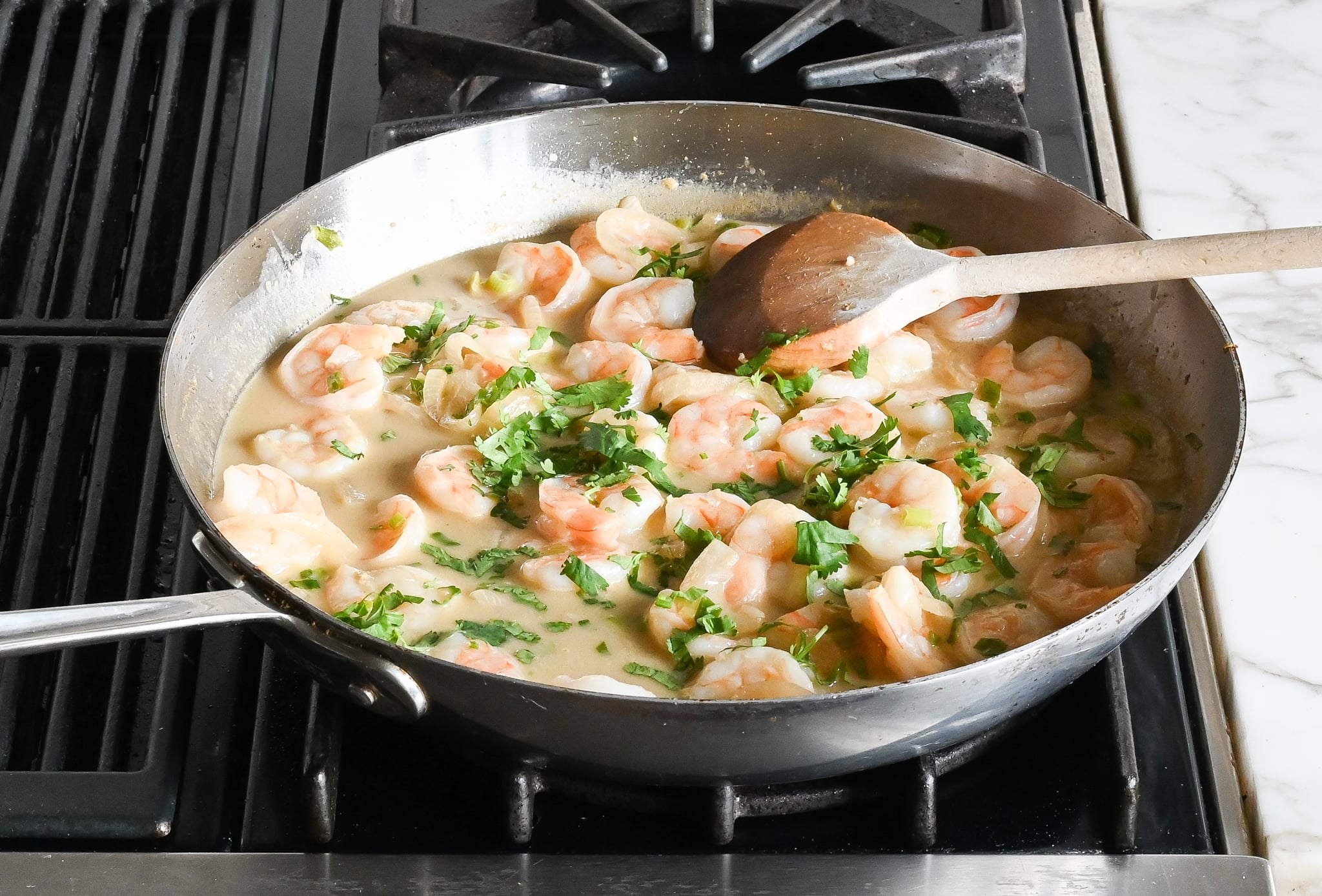 Cilantro and shrimp in a coconut milk mixture.