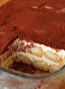 Baking dish of partially-served tiramisu.