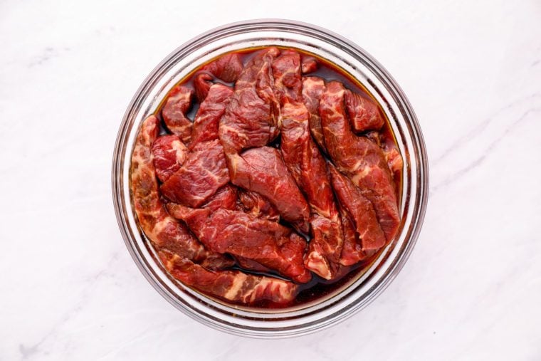 beef marinating in bowl