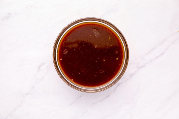 remaining soy sauce, cornstarch, remaining 3 tablespoons of Shaoxing wine (or dry sherry), oyster sauce, chicken broth, sugar, and sesame oil in bowl
