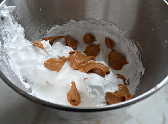 Dollops of peanut butter in an egg mixture.