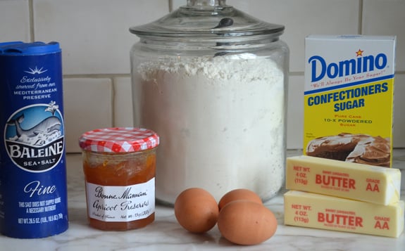 Hamantaschen ingredients including apricot preserves, egg, and butter.