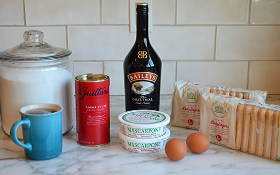 Tiramisu ingredients including Baileys, cocoa powder, and mascarpone.