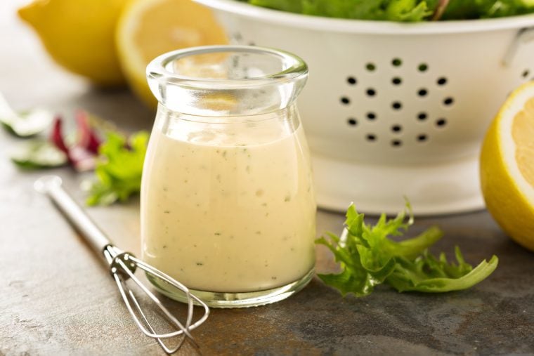 Small glass of creamy Greek yogurt dressing.
