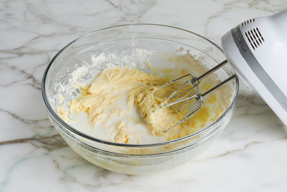 adding the milk to the batter