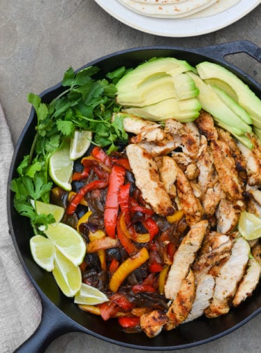 Skillet of chicken fajita fixings.