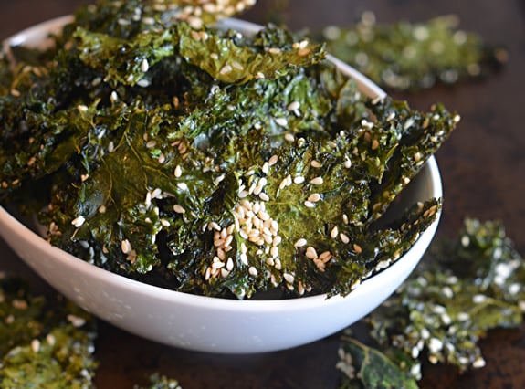 Bowl of maple sesame kale chips.
