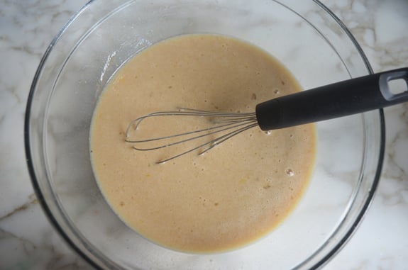 Wet muffin batter in a bowl.