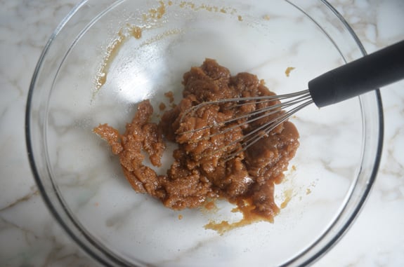 Whisk stirring butter and brown sugar together.