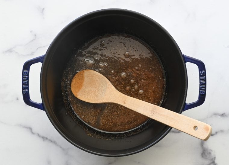 oil and garam masala in dutch oven
