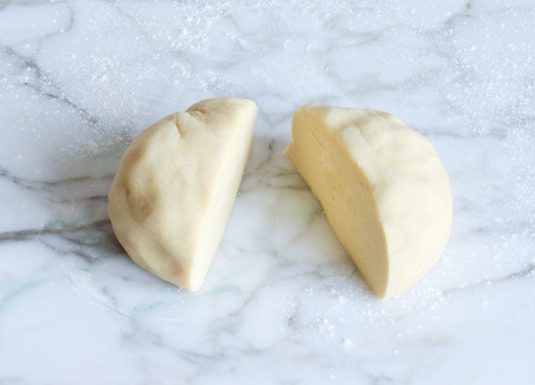 Ball of dough cut in half.