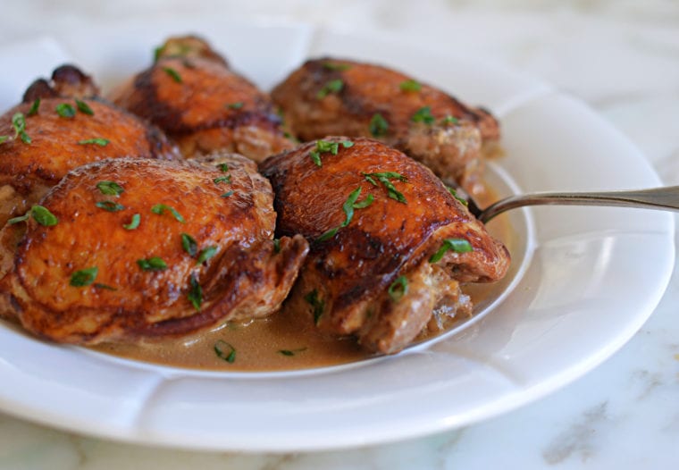 Chicken adobo on a plate.