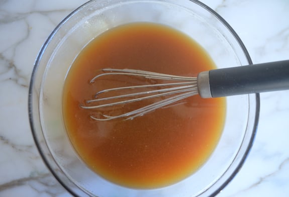 Whisk in a bowl of butter and syrup.