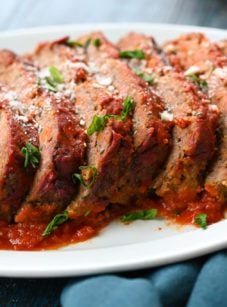 Sliced Italian meatloaf on a platter.