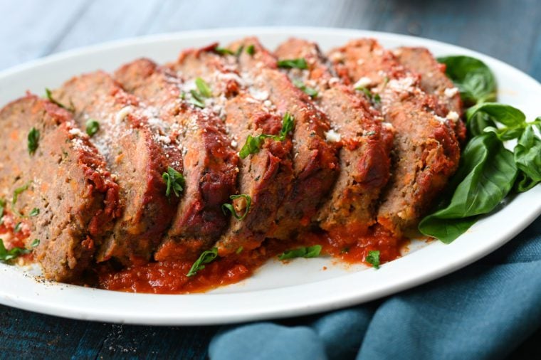 Sliced Italian meatloaf on a platter.