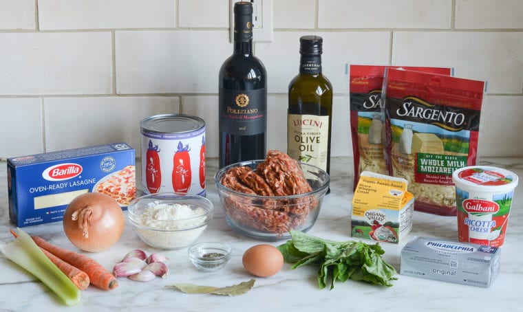 Lasagna ingredients including mozzarella, olive oil, and egg.